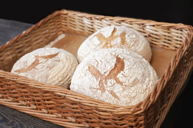 Freshly baked loaves of bread in wicker tray