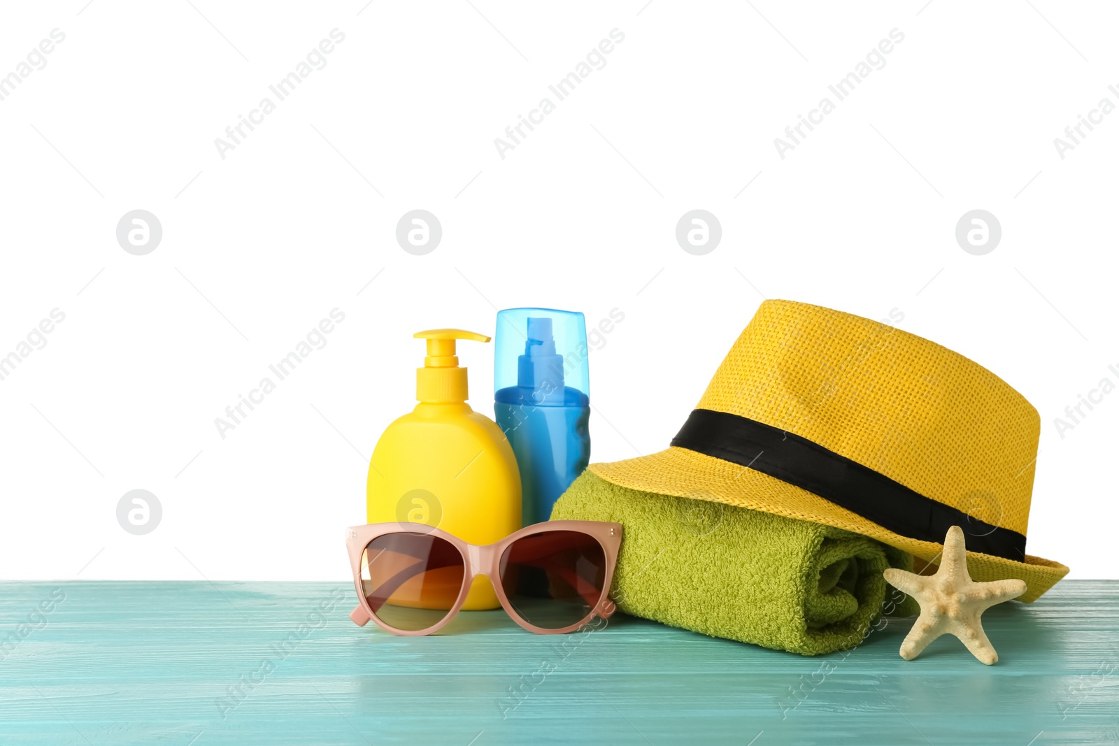 Photo of Set of beach accessories on table against white background. Space for text