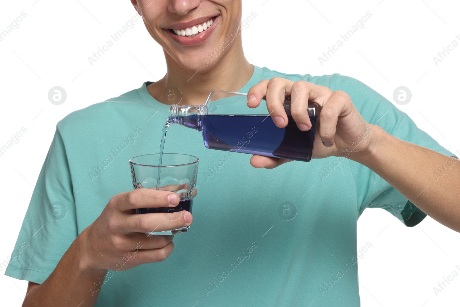 Photo of Young man with mouthwash on white background, closeup