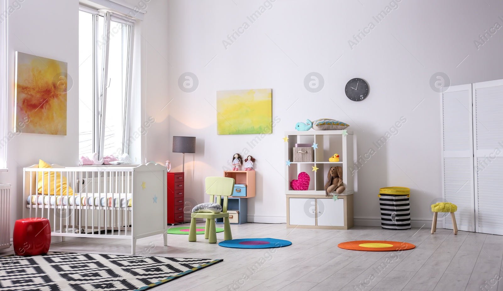 Photo of Baby room interior with comfortable crib