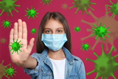 Image of Stop Covid-19 outbreak. Little girl wearing medical mask surrounded by virus on pink background