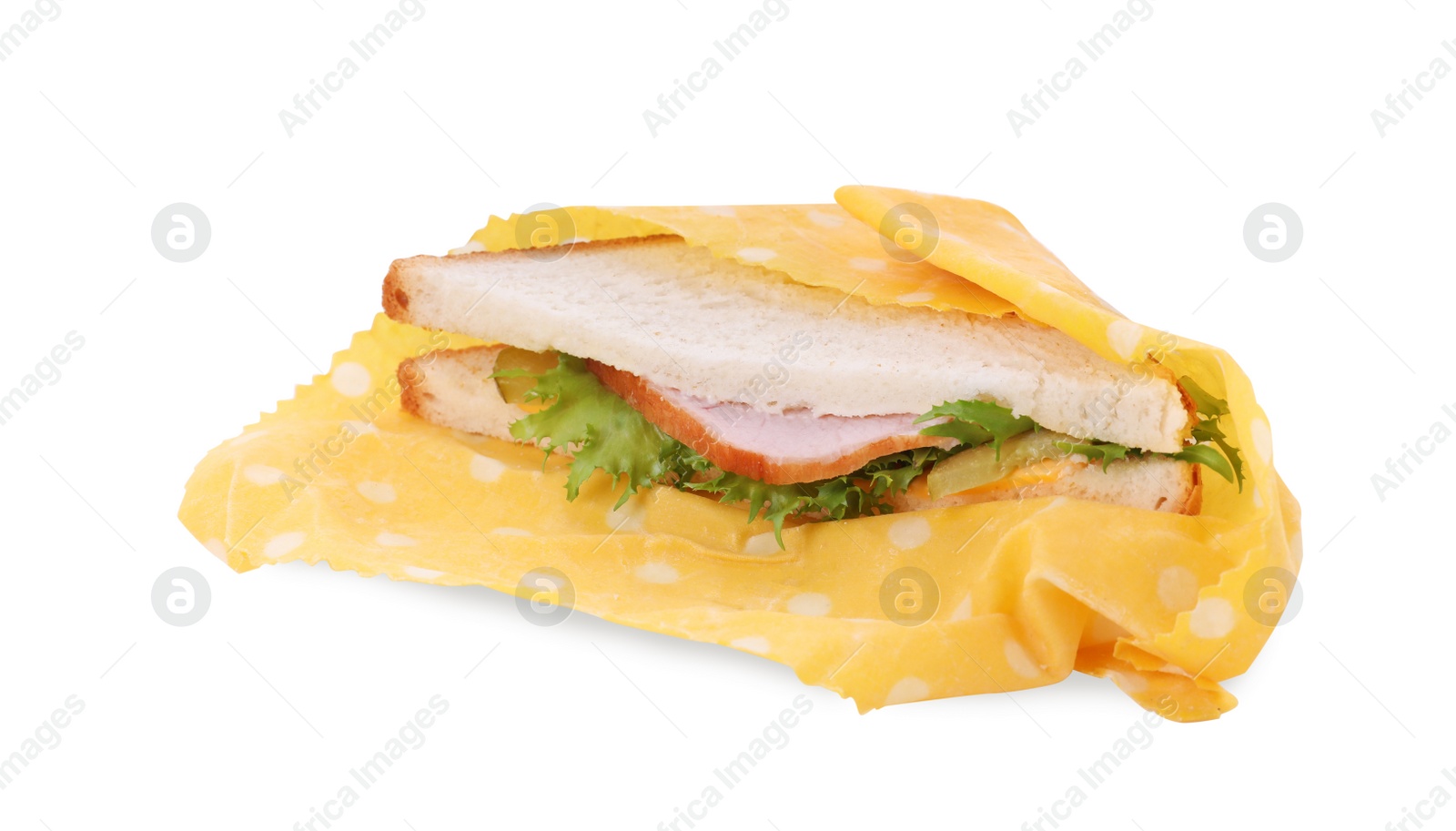 Photo of Tasty sandwich in beeswax food wrap isolated on white