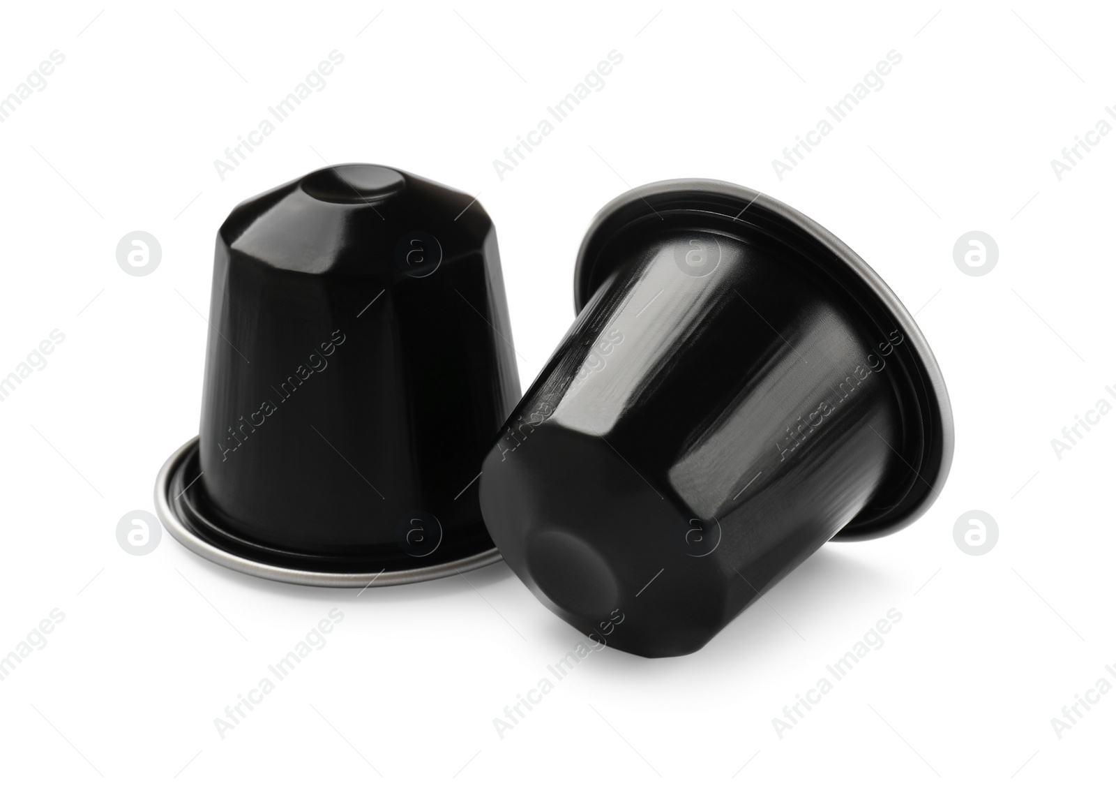 Photo of Two plastic coffee capsules isolated on white