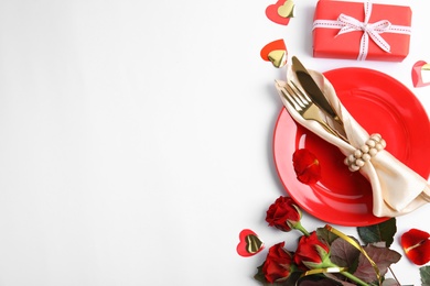 Photo of Beautiful table setting for romantic dinner on white background, flat lay. Valentine's day celebration