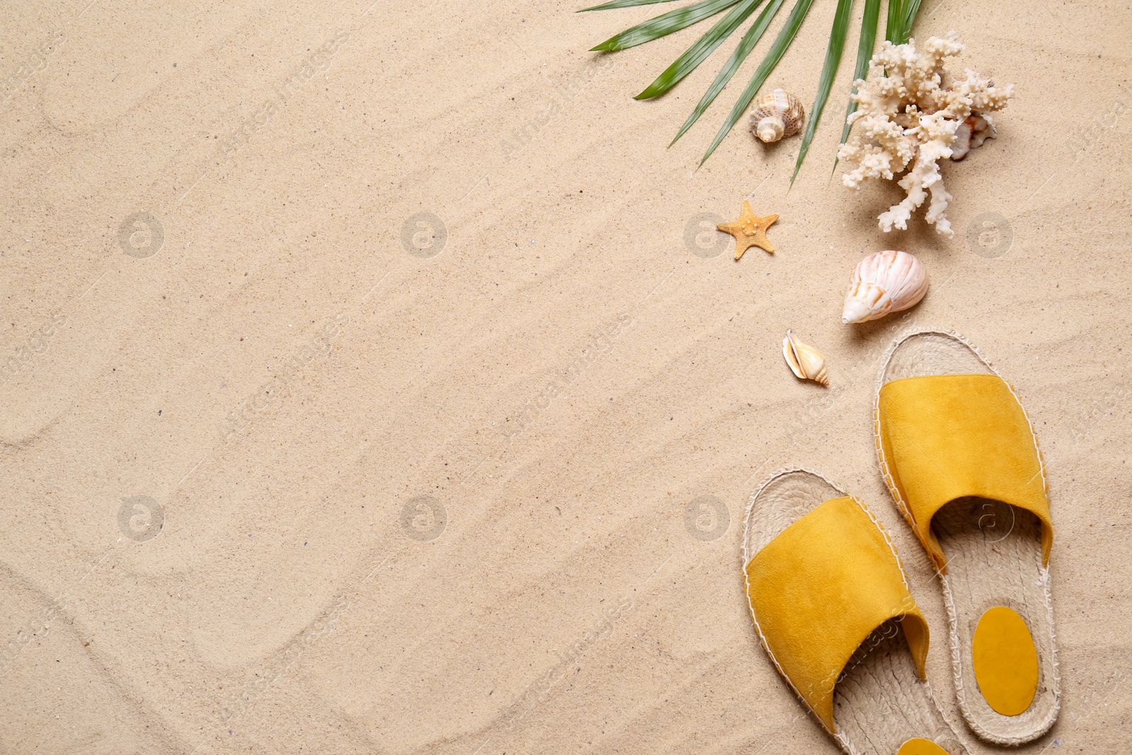 Photo of Flat lay composition with beach items on sand, space for text. Summer vacation