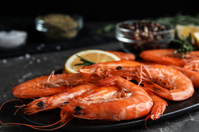 Delicious cooked shrimps on slate plate, closeup