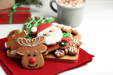 Photo of Tasty homemade Christmas cookies on white wooden table. Space for text