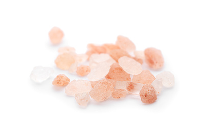 Photo of Pile of pink himalayan salt isolated on white