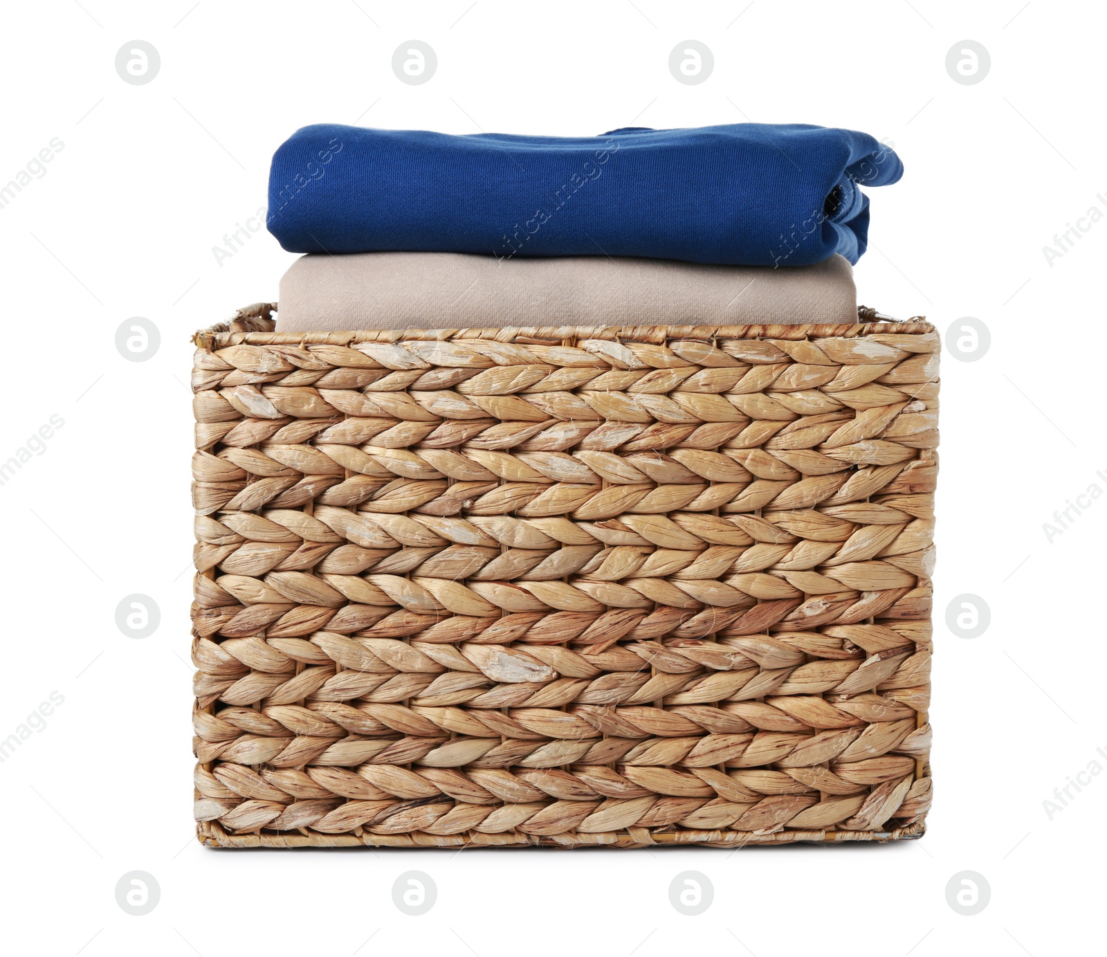 Photo of Wicker laundry basket with clean clothes isolated on white