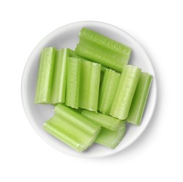 Photo of Bowl of fresh cut celery isolated on white, top view