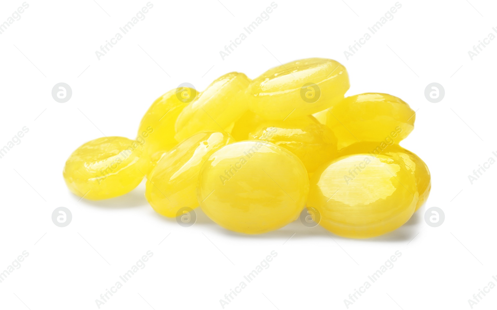 Photo of Tasty small lemon drops isolated on white