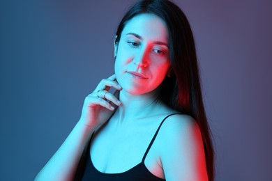 Photo of Portrait of beautiful young woman on color background