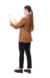 Woman holding tablet with blank screen on white background