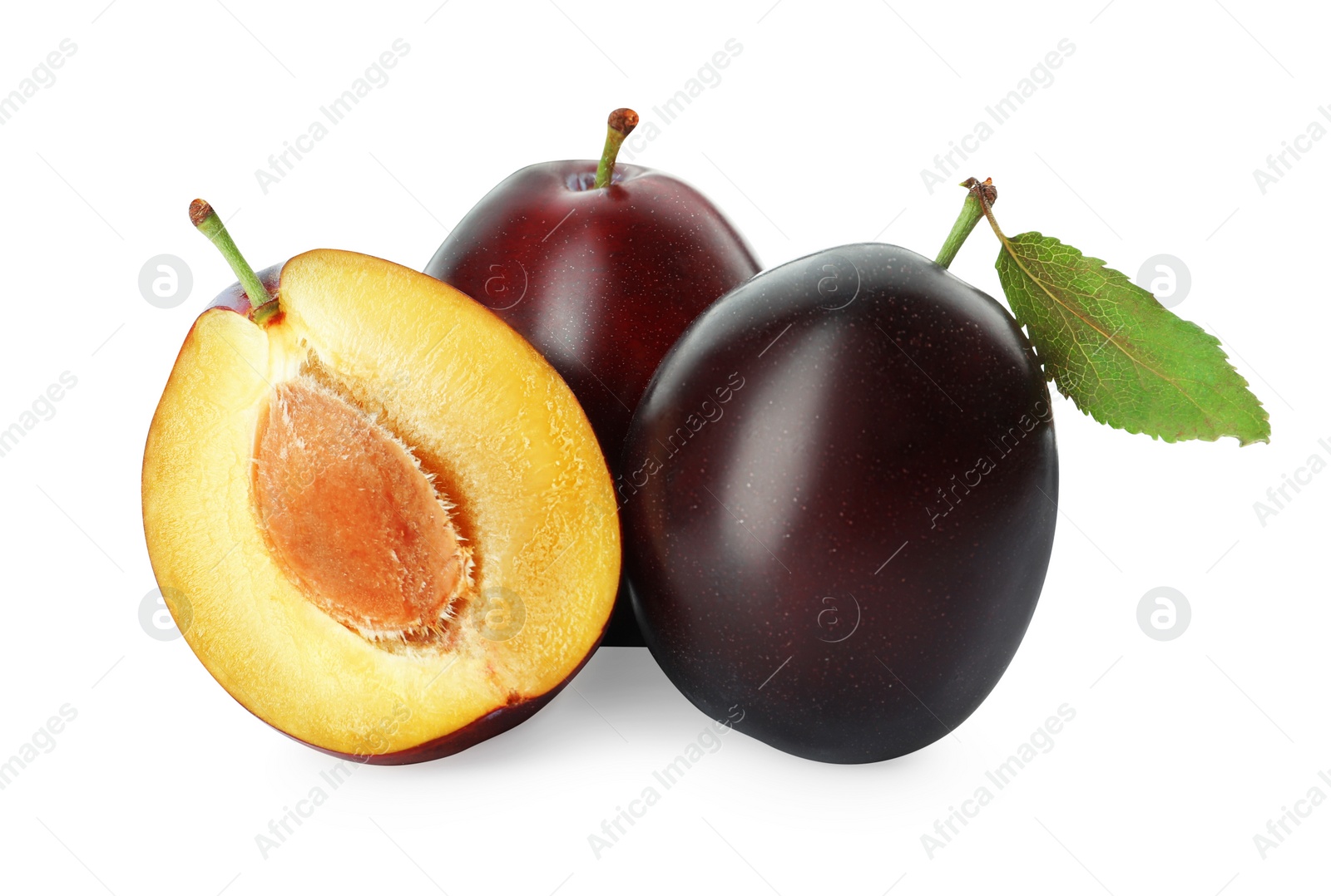 Photo of Whole and cut ripe plums on white background