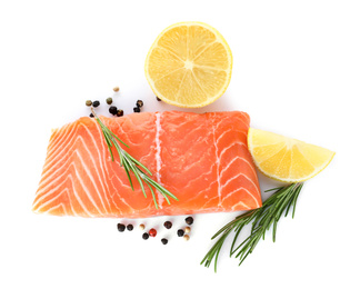 Photo of Fresh raw salmon with pepper, lemon and rosemary on white background, top view. Fish delicacy