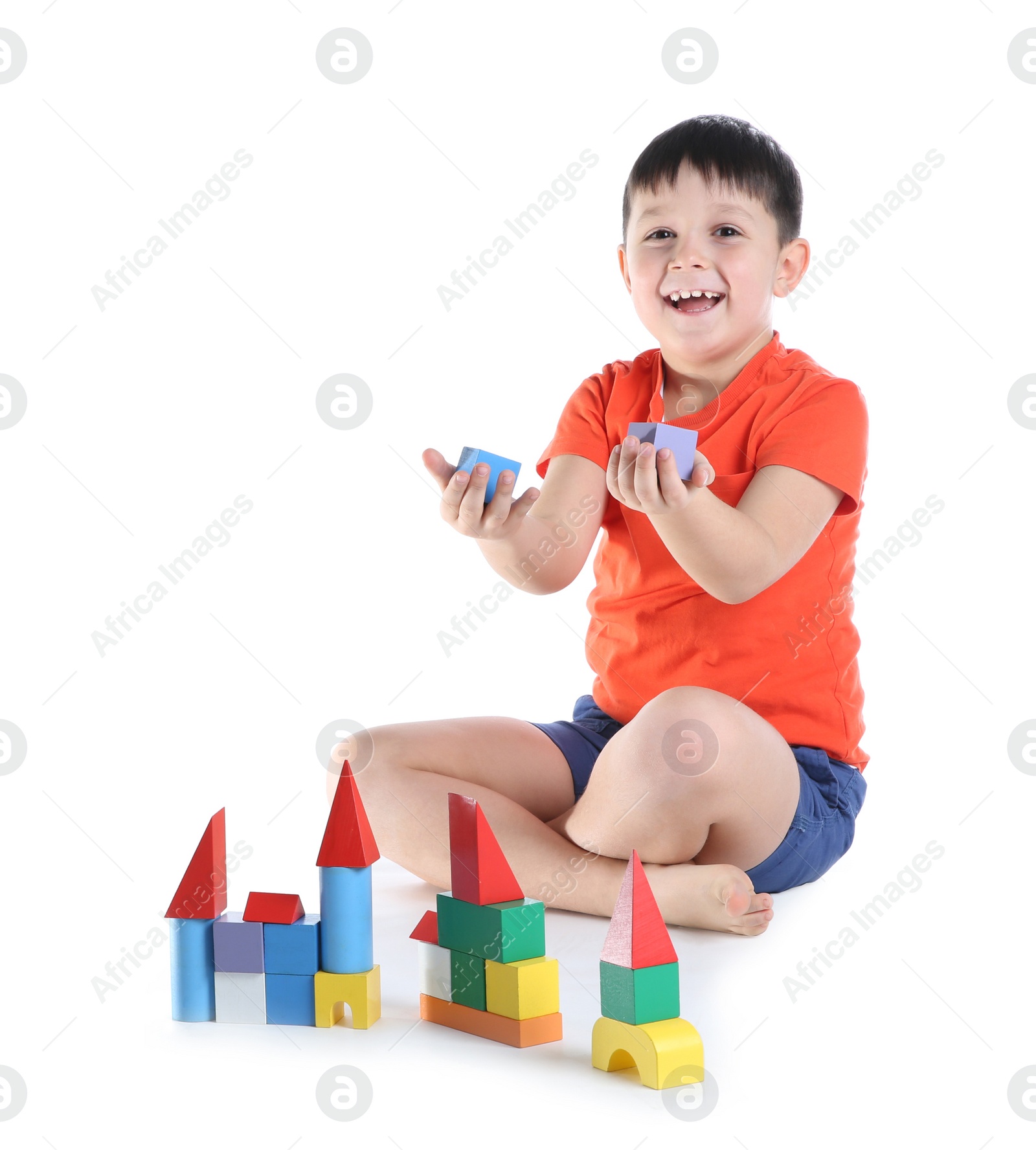 Photo of Cute child playing with colorful blocks on white background