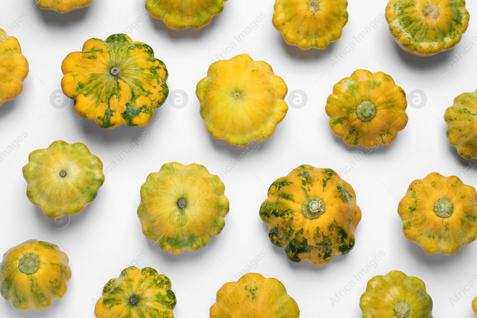 Photo of Fresh ripe pattypan squashes on white background, top view