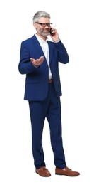 Mature businessman in stylish clothes talking on smartphone against white background