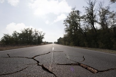 Large cracks on asphalt road after earthquake