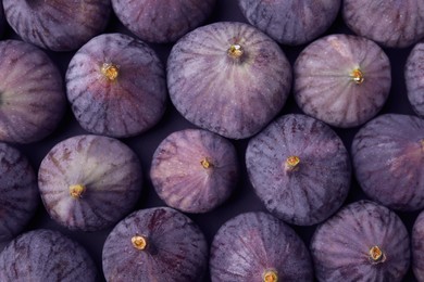 Fresh ripe figs as background, top view