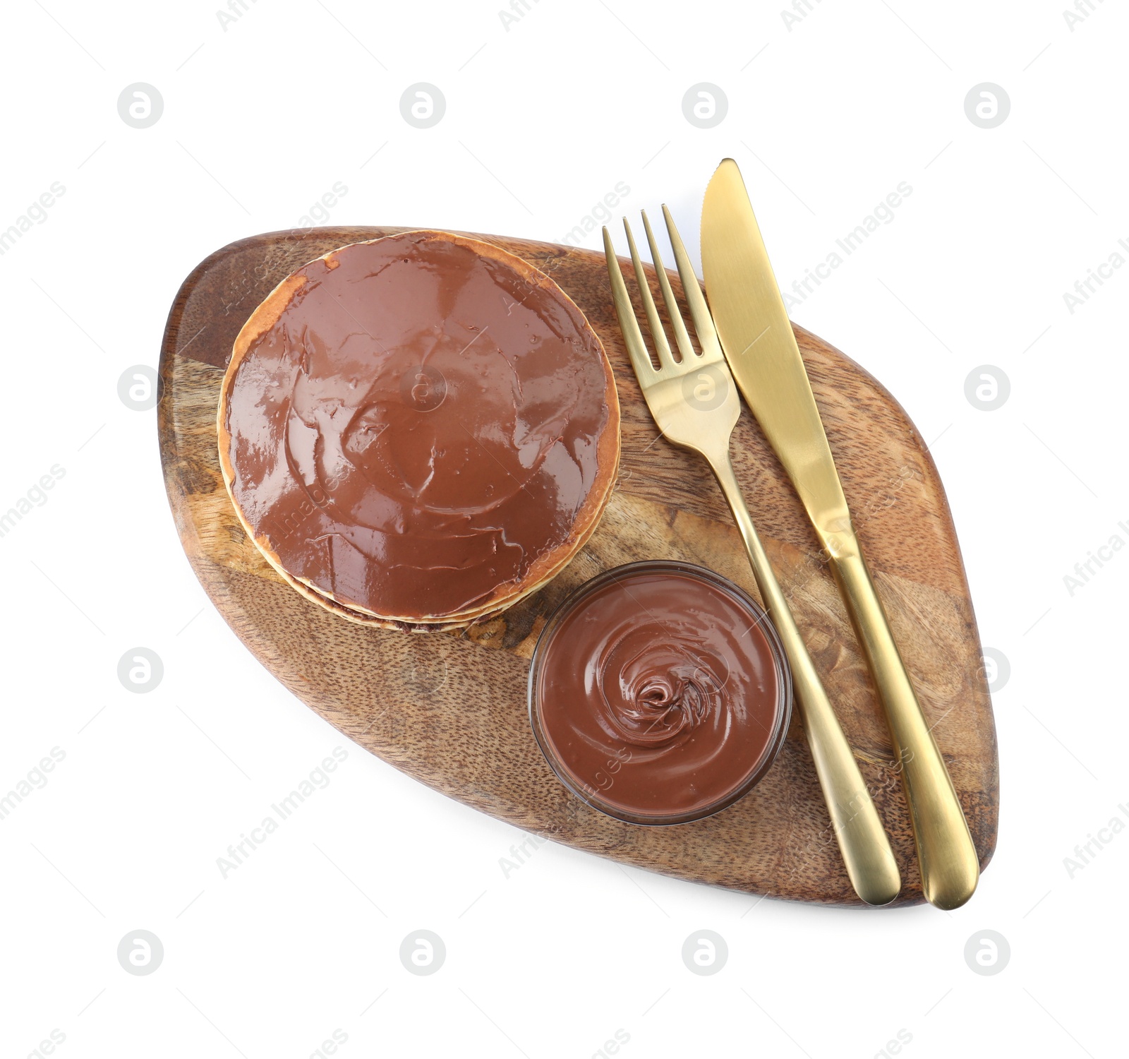 Photo of Tasty pancakes with chocolate paste and cutlery isolated on white, top view