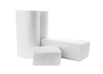 Clean tissues and rolls with paper towels isolated on white