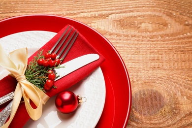 Photo of Beautiful Christmas table setting on wooden background, top view