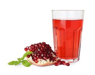Photo of Refreshing pomegranate juice in glass, leaves and fruit isolated on white