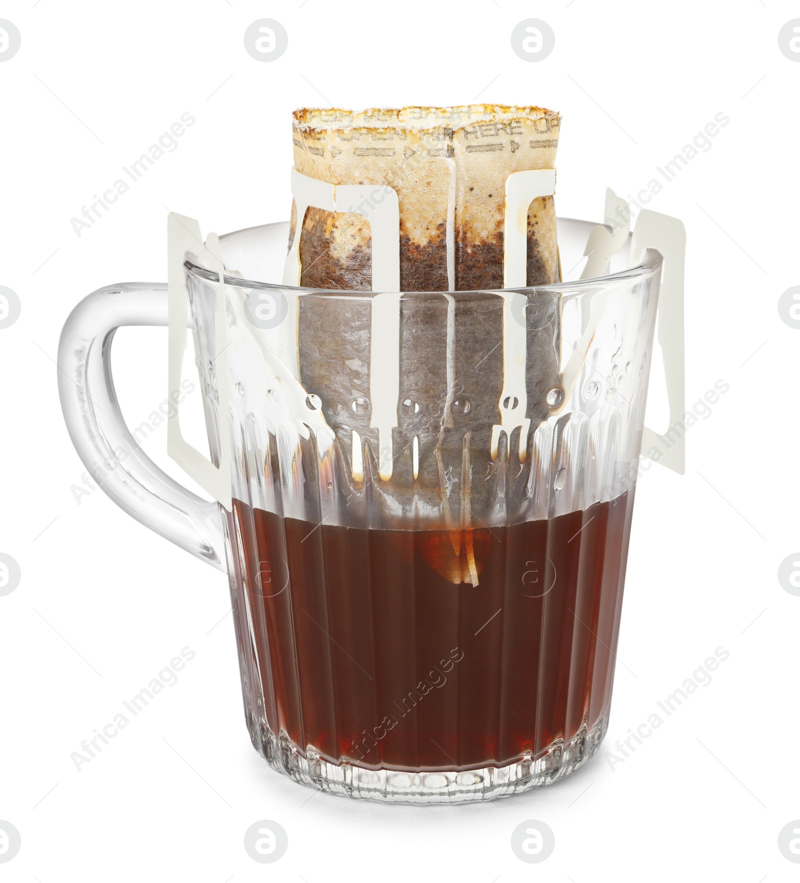 Photo of Glass cup with drip coffee bag isolated on white