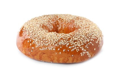 Photo of Delicious fresh bagel with sesame seeds isolated on white