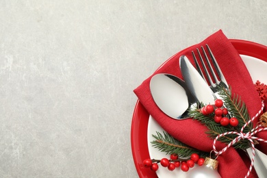 Photo of Beautiful Christmas table setting on light grey background, top view. Space for text
