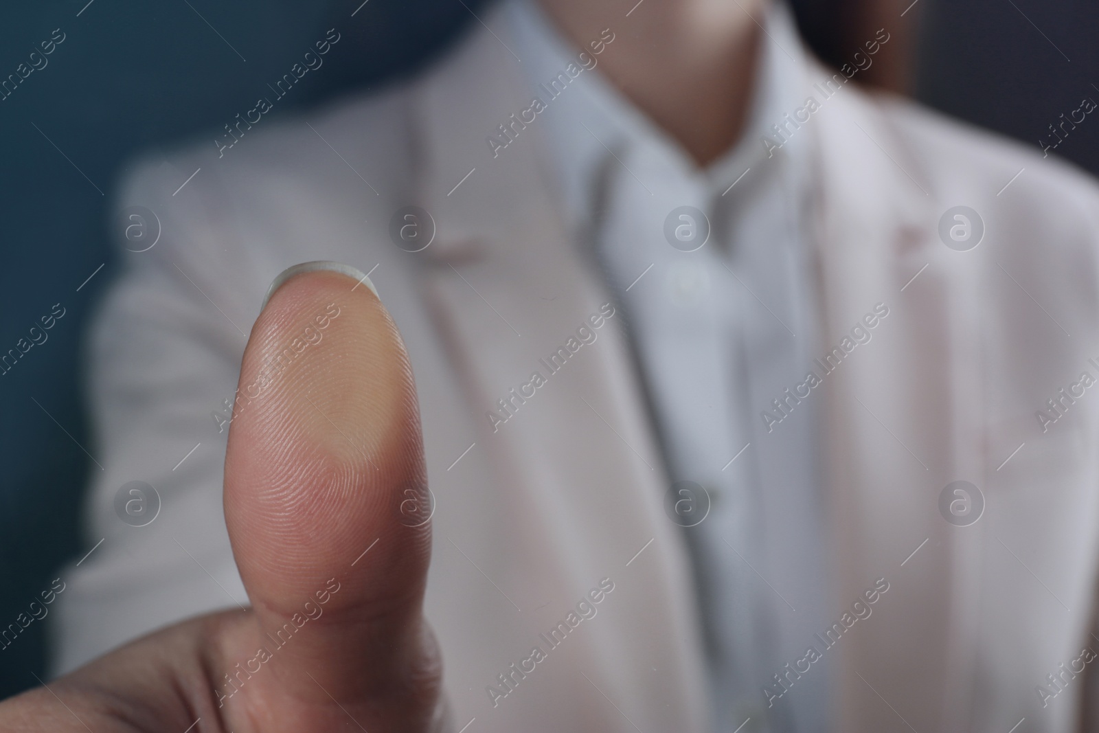 Photo of Businesswoman pressing control glass of biometric fingerprint scanner, closeup. Space for text