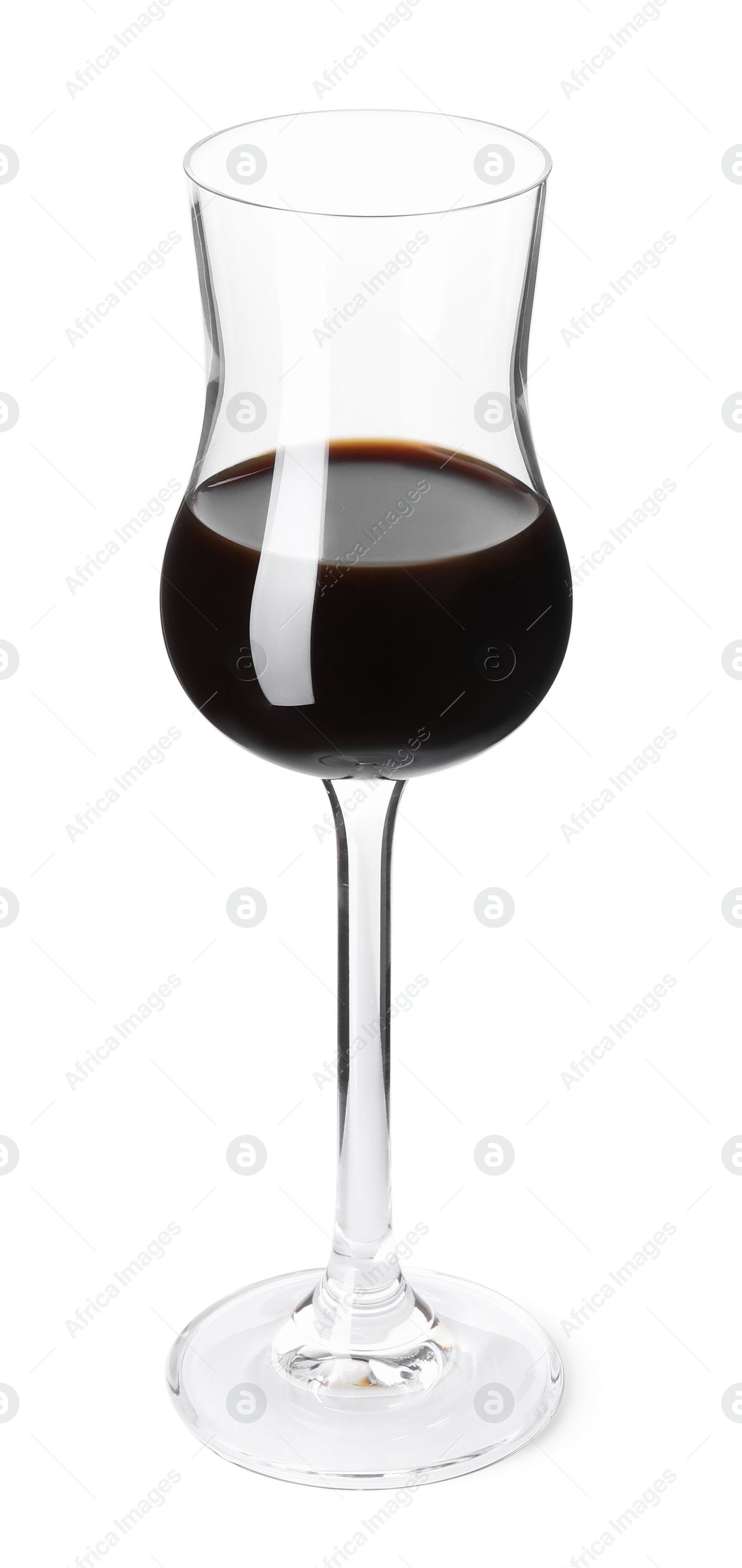 Photo of Shot glass with coffee liqueur isolated on white