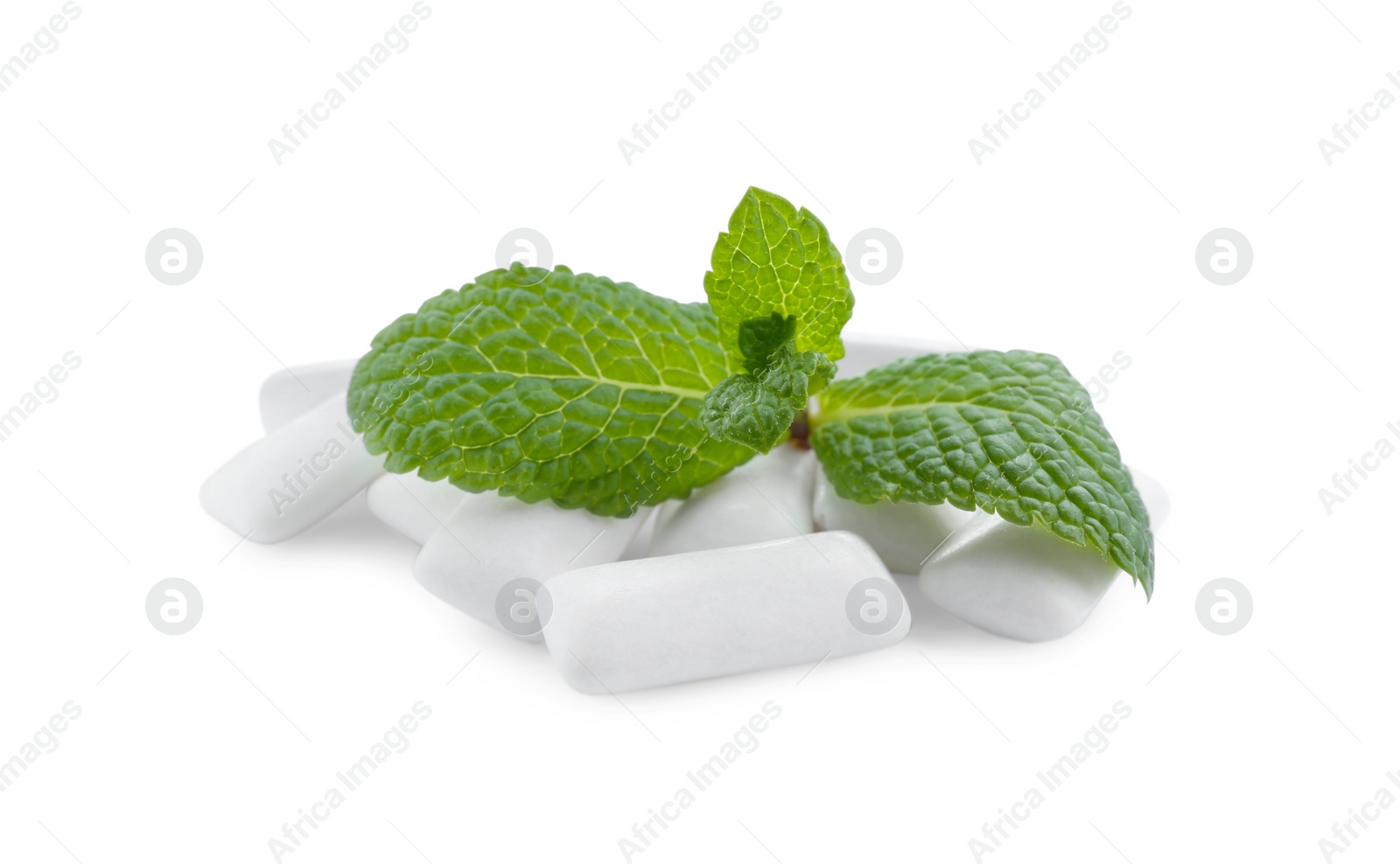 Photo of Heap of chewing gum pieces and mint on white background