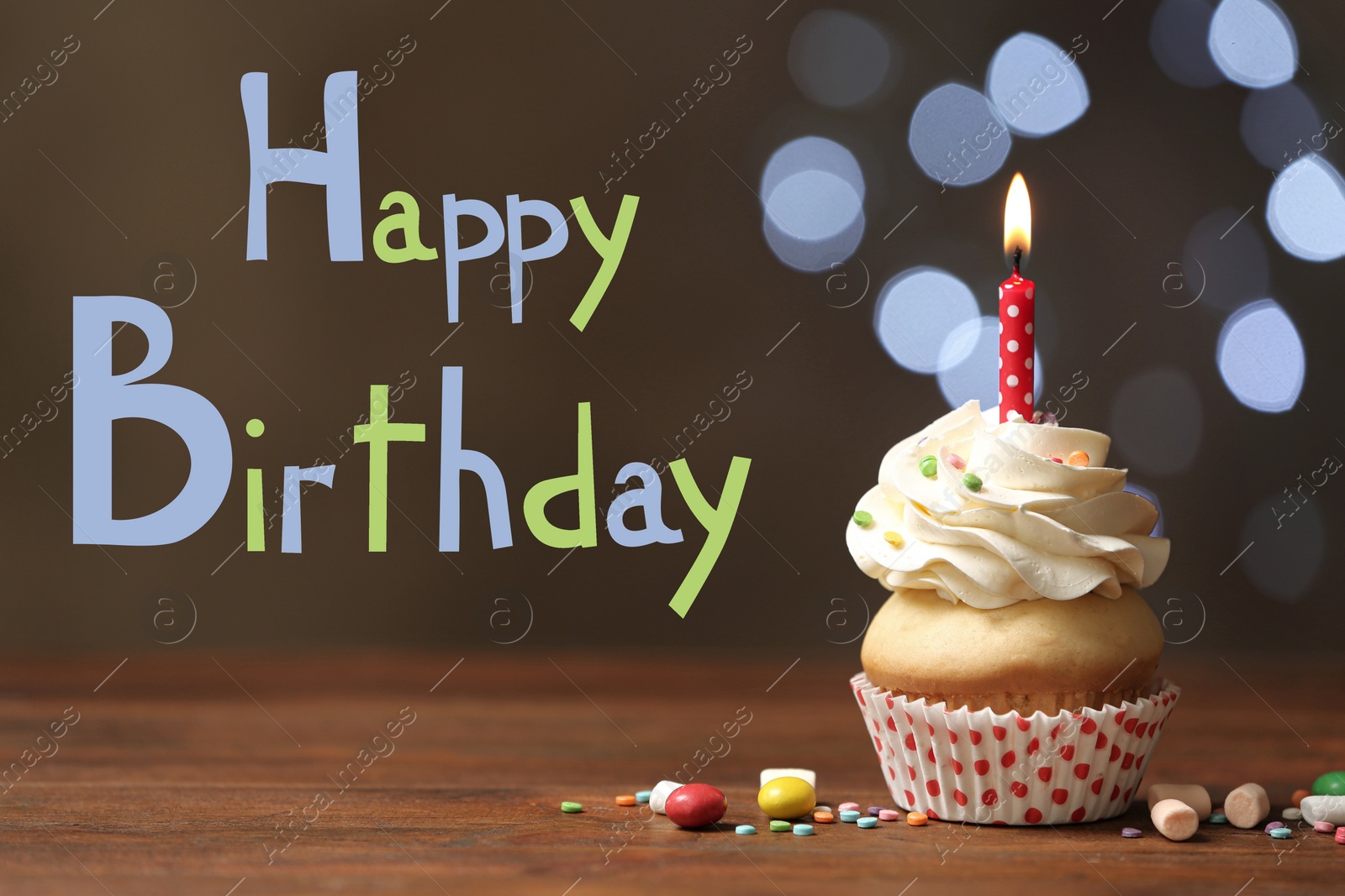 Image of Text Happy Birthday and delicious cupcake with candle on blurred background