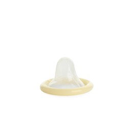 Photo of Unpacked beige condom isolated on white. Safe sex