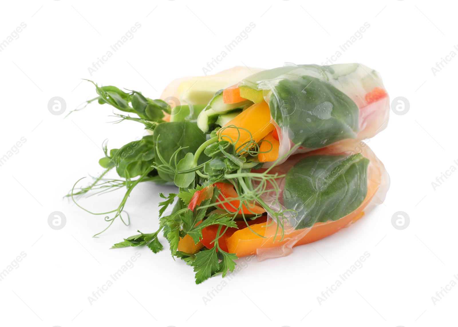 Photo of Delicious rolls wrapped in rice paper isolated on white, top view