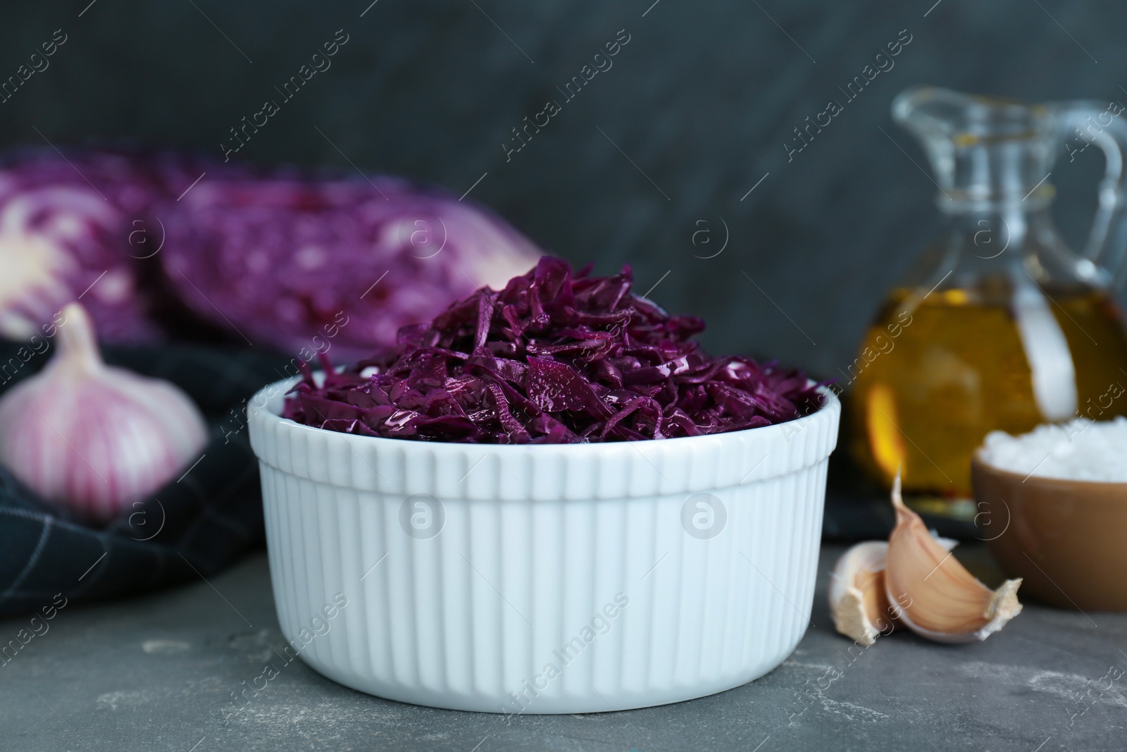 Photo of Tasty red cabbage sauerkraut on light grey table