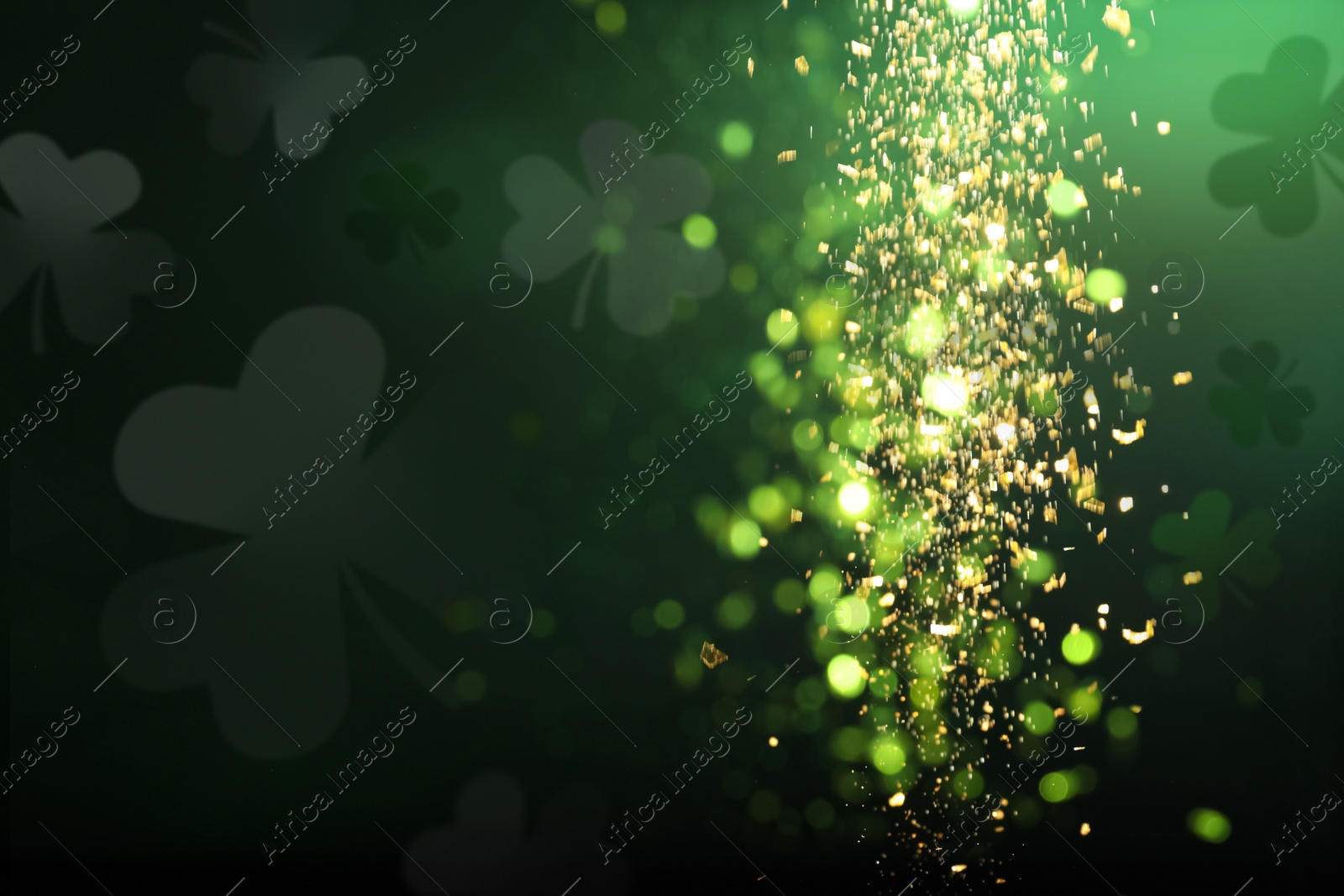 Image of St. Patrick's Day celebration. Clover leaves on dark background, bokeh effect