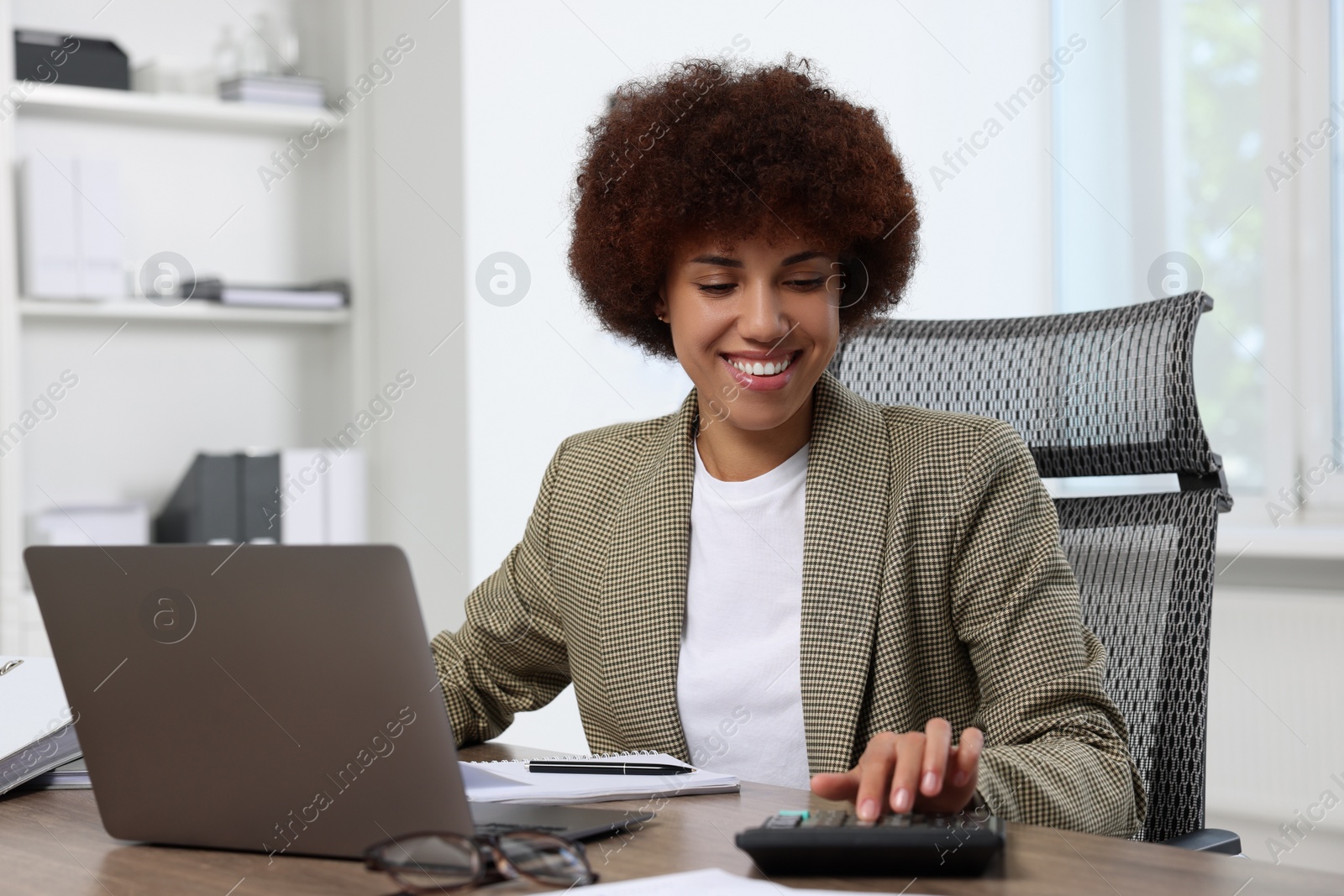 Photo of Professional accountant working at wooden desk in office