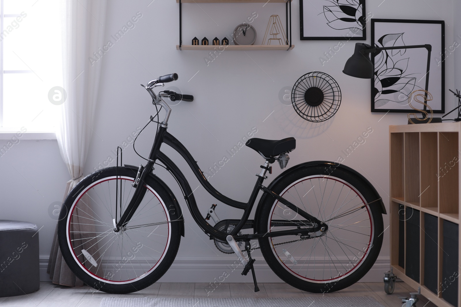 Photo of Stylish room with modern bicycle. Idea for interior decor