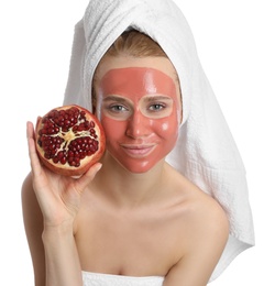 Photo of Young woman with pomegranate face mask and fresh fruit on white background