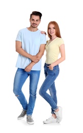 Photo of Young couple in stylish jeans on white background