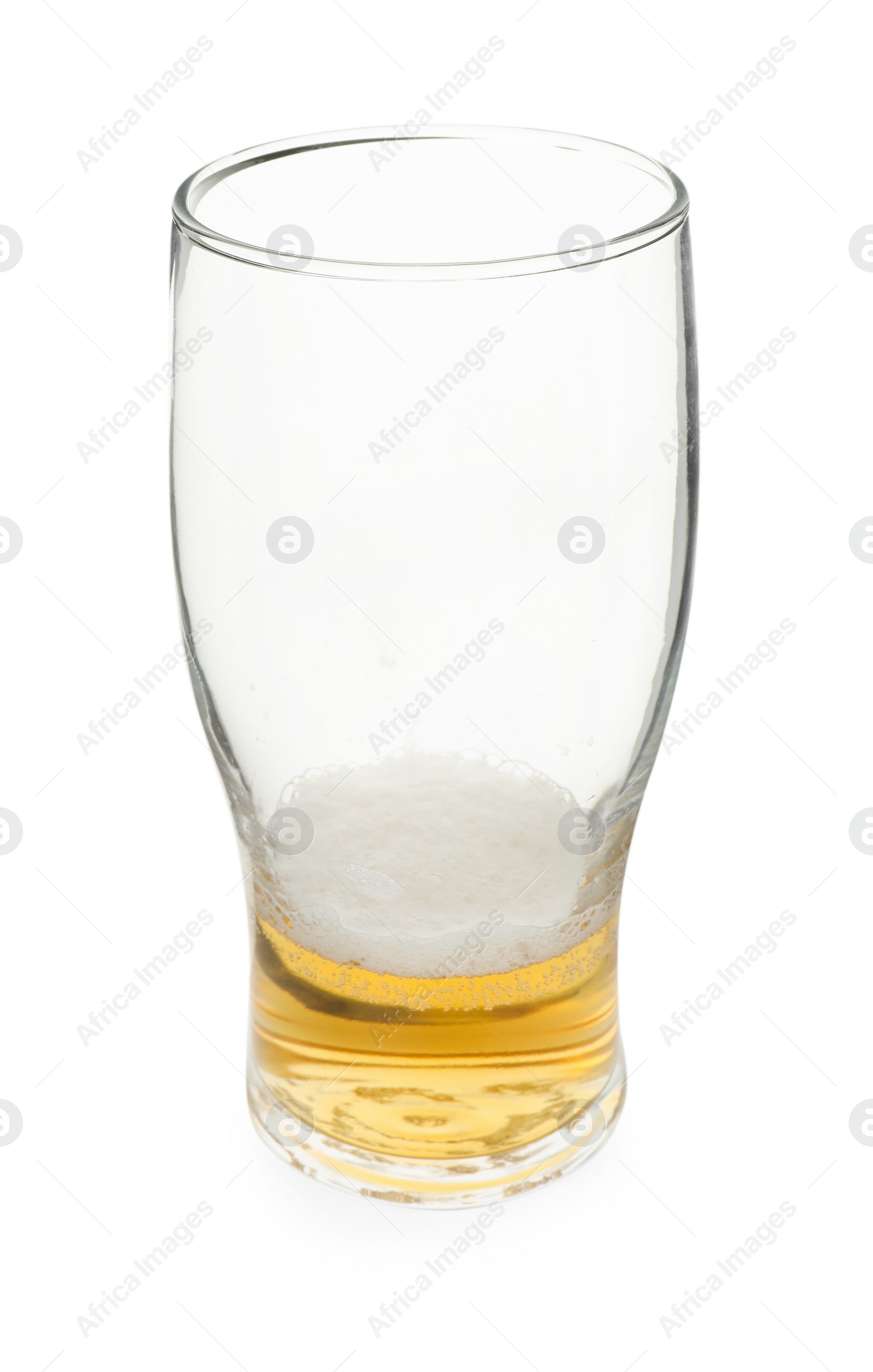 Photo of Almost empty glass of beer isolated on white