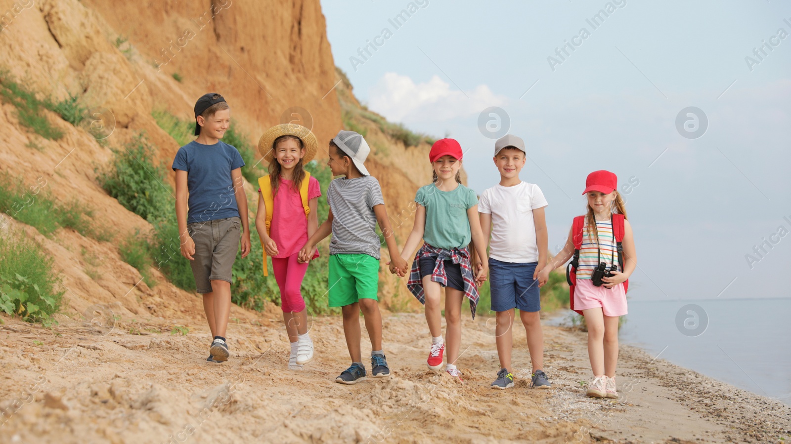 Photo of Cute little children outdoors on summer day. Camping trip