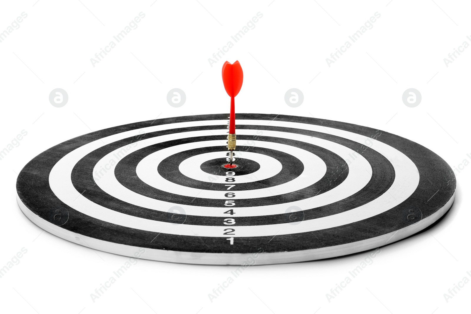 Photo of Red arrow hitting target on dart board against white background