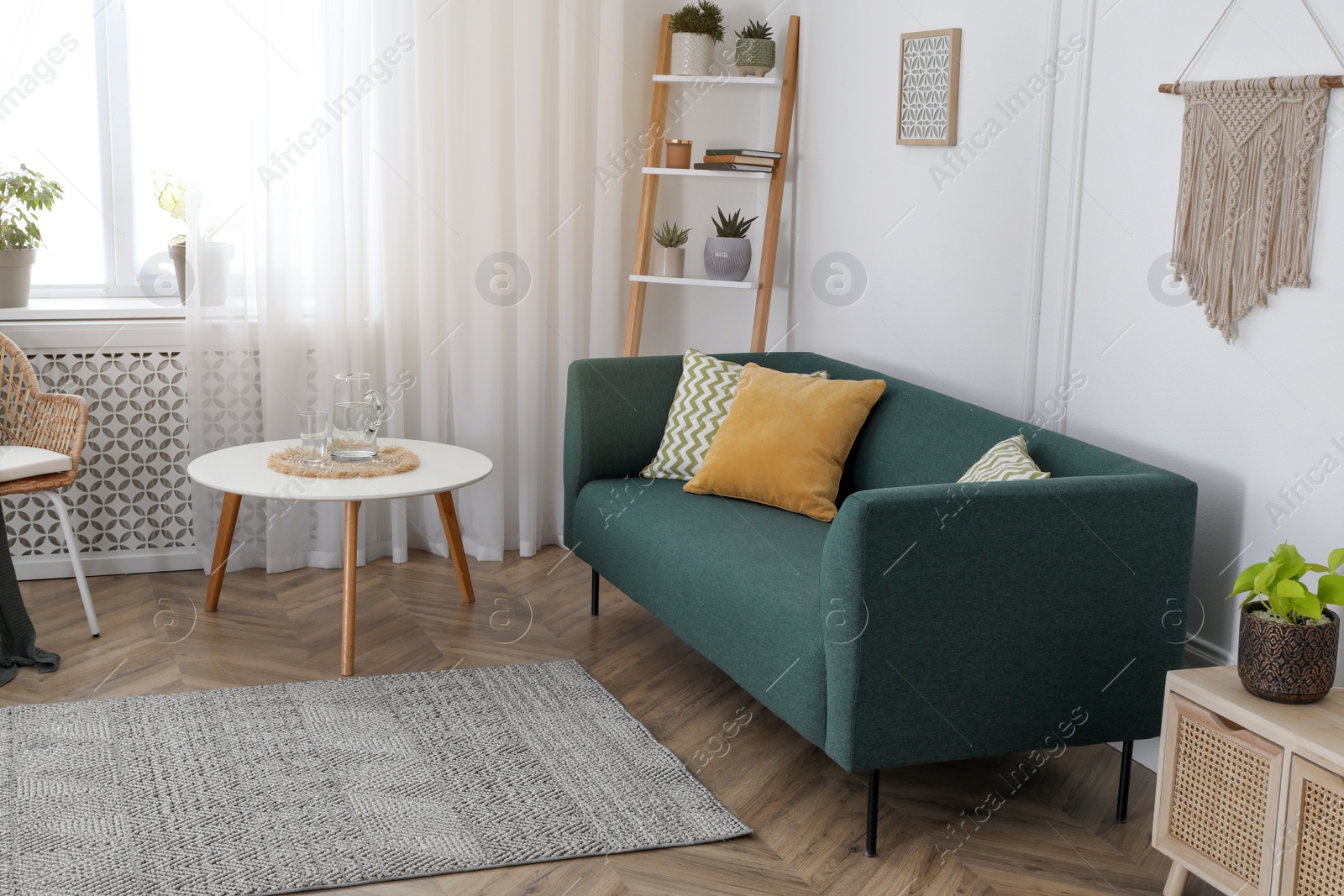 Photo of Stylish living room interior with comfortable sofa and small table