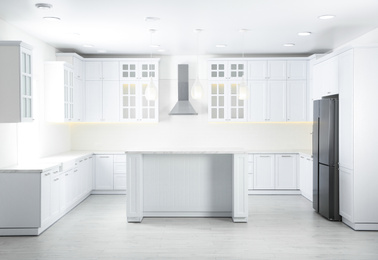 Interior of modern light kitchen with stylish furniture