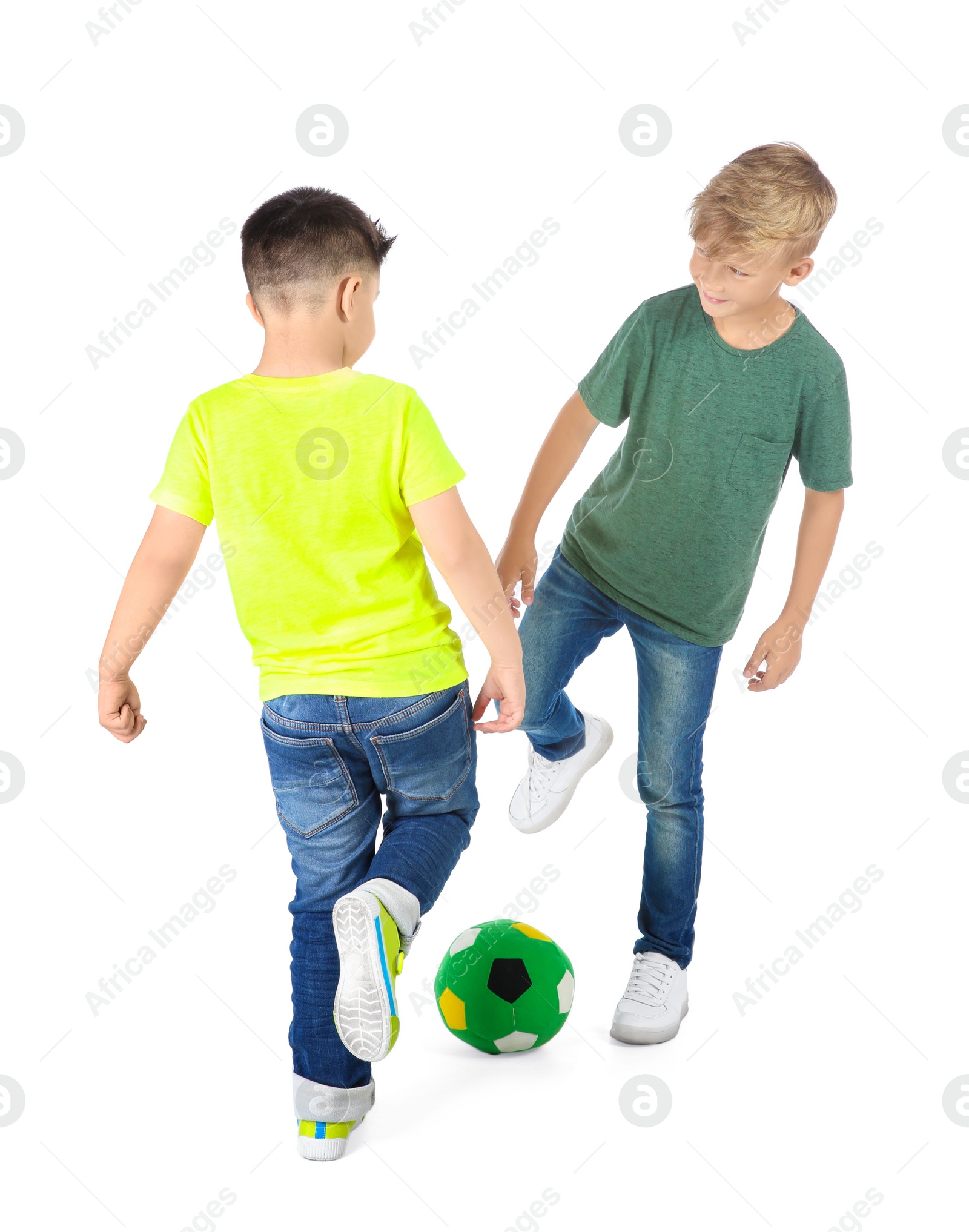 Photo of Little children playing soccer on white background. Indoor entertainment