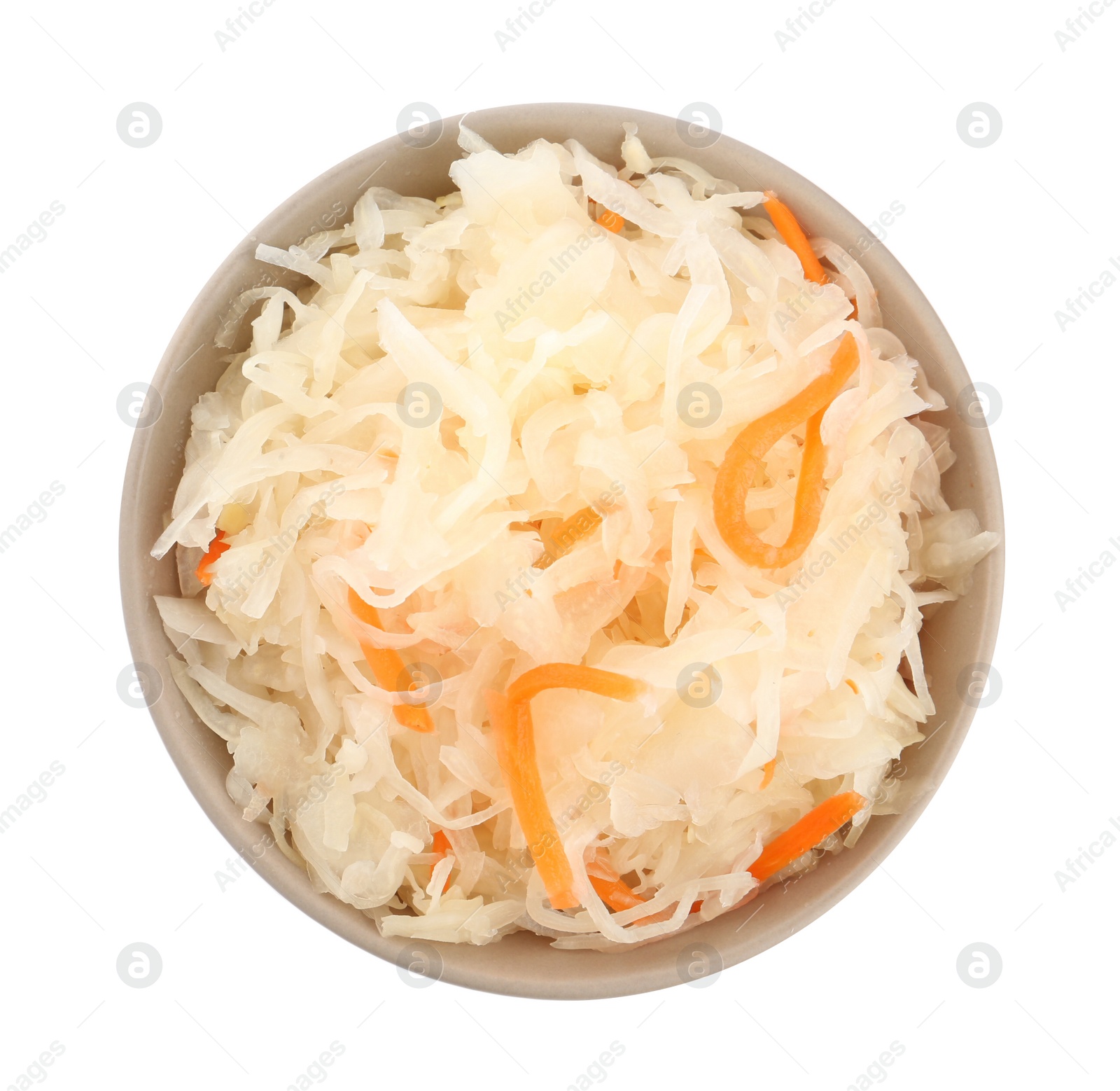 Photo of Bowl of tasty fermented cabbage with carrot isolated on white, top view